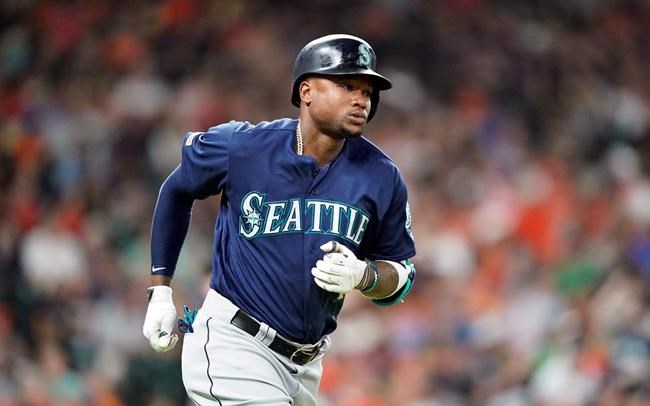 FILE - In this June 29, 2019, file photo, Seattle Mariners' Tim Beckham runs the bases after hitting a two-run home run against the Houston Astros during the second inning of a baseball game, in Houston. Seattle Mariners infielder Tim Beckham has been suspended 80 games as part of baseball's joint drug agreement after testing positive for stanozolol, a banned performance-enhancer, Major League Baseball announced Tuesday, Aug. 6, 2019. Beckham's suspension is effective immediately and ends his season. (AP Photo/David J. Phillip, File)