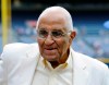 FILE - In this Aug. 18, 2012, file photo, former Dodgers pitcher Don Newcombe stands on the field at Turner Field, where he received the Beacon of Hope Award before the Civil Rights Game, in Atlanta. Newcombe, the hard-throwing Brooklyn Dodgers pitcher who was one of the first black players in the major leagues and who went on to win the rookie of the year, Most Valuable Player and Cy Young awards, has died. He was 92. The team confirmed that Newcombe died Tuesday morning, Feb. 19, 2019, after a lengthy illness.(AP Photo/John Amis, File)