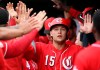 FILE - In this Monday, March 11, 2019 file photo, Cincinnati Reds' Nick Senzel (15) celebrates his run scored against the Cleveland Indians during the second inning of a spring training baseball game in Goodyear, Ariz. The Cincinnati Reds could bring up top prospect Nick Senzel before the Friday, May 3, 2019 game against San Francisco, putting the 23-year-old outfielder in position to make his major league debut against the Giants. (AP Photo/Ross D. Franklin, File)