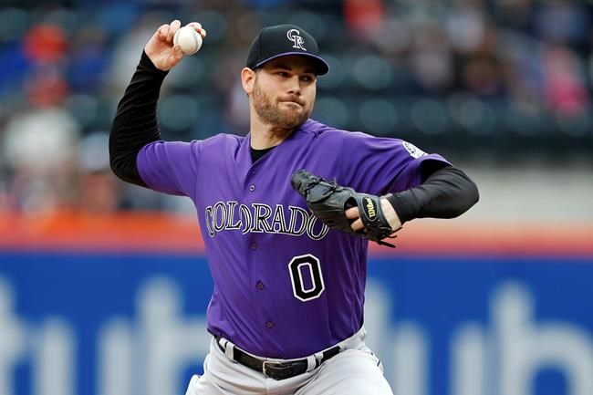 FILE - In this Sunday, May 6, 2018 file photo, Colorado Rockies relief pitcher Adam Ottavino delivers a pitch during the ninth inning of a baseball game against the New York Mets in New York. The New York Yankees finalized its $27 million, three-year contract with reliever Adam Ottavino on Thursday, Jan. 24, 2019 and said the 33-year-old right-hander will become the first player in the history of the tradition-bound team to wear No. 0. (AP Photo/Adam Hunger, File)