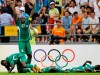 CORRECTS THE DATE TO AUG. 13, NOT AUG. 12, AS ORIGINALLY SENT - - FILE - In this Aug. 13, 2008, file photo, Nigeria's Promise Isaac, left, celebrates with his teammates after scoring against the United States during a 2008 Olympics first round soccer match in Beijing. Promise Isaac, who captained Nigeria to the 2008 Olympic silver medal and scored 79 goals in 11 professional seasons in Turkey, died late Wednesday, Oct. 2, 2019, after collapsing at his apartment gym in Austin, Texas, authorities said. He was 31. (AP Photo/Petr David Josek, File)