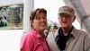 FILE - In this Aug. 15, 2009, file photo, sports writer Dan Jenkins, right, stands next to his daughter, Sally Jenkins, at the PGA Championship at Hazeltine National Golf Club in Chaska, Minn. Jenkins, the sports writing great and best-selling author known for his humor, has died. He was 89. TCU athletic director Jeremiah Donati confirmed Jenkins died Thursday, March 7, 2019, in his hometown of Fort Worth, Texas. (AP Photo/Jeff Roberson, File)