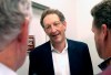 FILE - In this Monday, Oct. 5, 2015 file photo, San Francisco Giants president and CEO Larry Baer speaks to reporters after a news conference in San Francisco. A video posted by TMZ on Friday, March 1, 2019 shows Giants President and CEO Larry Baer in a physical altercation with his wife in a San Francisco park. Baer's wife, Pam, was seated in a chair when he reached over her to grab for a cellphone in her right hand and she toppled sideways in the chair screaming 