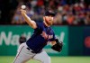 FILE - In this Friday, Aug. 16, 2019 file photo, Minnesota Twins relief pitcher Sam Dyson throws to the Texas Rangers in the seventh inning of a baseball game in Arlington, Texas. Minnesota reliever Sam Dyson had surgery on his shoulder, ending the right-hander's season and potentially putting 2020 in jeopardy as well. Dyson had the capsule repair operation Tuesday, Sept. 24, 2019 in California. (AP Photo/Tony Gutierrez, File)