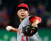 FILE - In this Tuesday, Sept. 4, 2018 file photo, Los Angeles Angels relief pitcher Junichi Tazawa (47) works the seventh inning against the Texas Rangers in a baseball game in Arlington, Texas. Reliever Junichi Tazawa has finalized a minor league contract with the Chicago Cubs and will report to big league spring training. If added to the 40-man roster, Tazawa would receive a one-year contract paying $800,000 while in the major leagues. He could earn $450,000 in performance bonuses for games pitched and $750,000 for games finished. The 32-year-old right-hander was with a 7.07 ERA in 31 games last season for Miami and the Los Angeles Angels. (AP Photo/Richard W. Rodriguez, File)