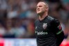 FILE - In this Aug. 17, 2019, file photo, D.C. United's Wayne Rooney reacts after putting a shot over top of the Vancouver Whitecaps' goal during the first half of an MLS soccer match in Vancouver, British Columbia. As his Major League Soccer career draws to a close and he prepares to return home, Wayne Rooney would like one more shot at the playoffs stateside. (Darryl Dyck/The Canadian Press via AP, File)