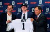 FILE - In this June 25, 2018, file photo, Detroit Tigers first overall pick Casey Mize, center, stands with Tigers scout Justin Henry, left, and Scott Pleis, director of amateur scouting, during a news conference where he was introduced to the media, in Detroit. Most of the team's top prospects are pitchers. (AP Photo/Carlos Osorio, File)