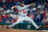 FILE - In this Aug. 28, 2018, file photo, Washington Nationals relief pitcher Greg Holland throws a pitch during the ninth inning of a baseball game against the Philadelphia Phillies, in Philadelphia. A person familiar with the deal tells The Associated Press that right-handed reliever Greg Holland and the Washington Nationals have an agreement in principle on a minor league contract, pending the completion of a successful physical exam. The person confirmed the move to the AP on condition of anonymity Tuesday, Aug. 13, 2019, because nothing had been announced by the team.(AP Photo/Chris Szagola, File)