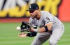 FILE - In this Sept. 19, 2018, file photo, Chicago White Sox's Yoan Moncada fields a ball hit by Cleveland Indians' Melky Cabrera during the fourth inning of a baseball game in Cleveland. Cabrera was out on the play. Moncada and pitchers such as Lucas Giolito and Michael Kopech have shown potential in the majors. (AP Photo/Tony Dejak, File)