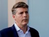FILE - In this Wednesday, Nov. 15, 2017 file photo, Hal Steinbrenner, principal owner, managing general partner and co-chairman of the New York Yankees, talks with reporters at the annual MLB baseball general managers' meetings in Orlando, Fla. Yankees owner Hal Steinbrenner would consider boosting payroll above the third luxury tax level in an effort to help New York win its first World Series in a decade, Wednesday, June 19, 2019. (AP Photo/John Raoux, File)