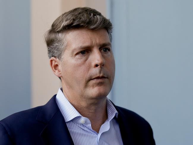 FILE - In this Wednesday, Nov. 15, 2017 file photo, Hal Steinbrenner, principal owner, managing general partner and co-chairman of the New York Yankees, talks with reporters at the annual MLB baseball general managers' meetings in Orlando, Fla. Yankees owner Hal Steinbrenner would consider boosting payroll above the third luxury tax level in an effort to help New York win its first World Series in a decade, Wednesday, June 19, 2019. (AP Photo/John Raoux, File)