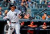 FILE - In this Saturday, March 30, 2019 file photo, New York Yankees right fielder Giancarlo Stanton waits for the pitch against the Baltimore Orioles during the fourth inning of a baseball game in New York. Giancarlo Stanton wants to return from his knee injury in time to fine-tune that powerful swing for October. Sidelined nearly all season, the New York Yankees slugger is hitting indoors and throwing as he rehabs from a sprained right knee that's been slow to heal since he got hurt June 25. (AP Photo/Julie Jacobson, File)