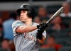 FILE - In this Tuesday, Aug. 14, 2018 file photo, Miami Marlins' J.T. Realmuto follows through on two-run base hit in the fourth inning of a baseball game against the Atlanta Braves in Atlanta. A person familiar with the negotiations says Miami Marlins All-Star catcher J.T. Realmuto has been traded to the Philadelphia Phillies for catcher Jorge Alfaro, two pitching prospects and international bonus pool allocation. The person confirmed the trade to The Associated Press on condition of anonymity Thursday, Feb. 7, 2019 because the teams had not announced it. (AP Photo/John Bazemore, File)