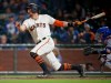 FILE - In this Tuesday, Sept. 12, 2017 file photo, San Francisco Giants' Hunter Pence hits a single to drive in a run against the Los Angeles Dodgers during the sixth inning of a baseball game in San Francisco. Hunter Pence has agreed to a minor league contract with his hometown Texas Rangers and will attend major league spring training. General major Jon Daniels said Thursday, Feb. 7, 2019 that the 35-year-old outfielder, who played winter ball, has a long track record of being a great teammate and is a winning player.(AP Photo/Tony Avelar, File)