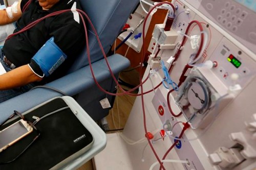 FILE - In this Monday, Sept. 24, 2018 file photo, a patient undergoes dialysis at a clinic in Sacramento, Calif. Results of a study released on Sunday, April 14, 2019 show that the diabetes drug Invokana has been shown to help prevent or delay worsening of kidney disease, which causes millions of deaths each year and requires hundreds of thousands of people to use dialysis to stay alive. (AP Photo/Rich Pedroncelli)