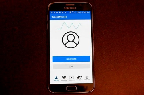 This image from video provided by the University of Washington in January 2019 shows a demonstration of the smartphone app developed by Rajalakshmi Nandakumar, Shyamnath Gollakota and Jacob E. Sunshine that uses sound waves to measure breathing. In first-step testing reported Wednesday, Jan. 9 the device detected early breathing problems in some people who‚Äôd just injected illegal drugs. (Mark Stone/University of Washington via AP)