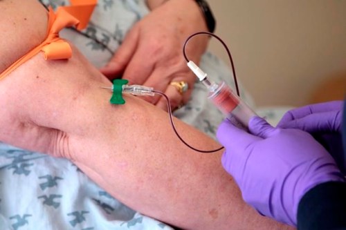 FILE - In this Tuesday, April 28, 2015 file photo, a patient has her blood drawn at a hospital in Philadelphia to monitor her cancer treatment. Companies are trying to develop blood tests that can look for signs of many types of cancer at once. (AP Photo/Jacqueline Larma, File)