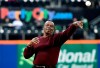 FILE - In this April 15, 2015, file photo, former New York Mets player Al Jackson, who pitched for the Mets from 1962-65, throws out the first ceremonial pitch before a baseball game against the Philadelphia Phillies at Citi Field in New York. Jackson, a tough left-hander who provided a rare glint of hope in the early days of the woebegone Mets, has died at 83. His death was announced by the Mets, for whom he worked for 50 years as a pitcher, major league coach, minor league pitching coordinator and front-office adviser. He died Monday, Aug. 19, 2019, at a nursing home in Port St. Lucie, Fla., after a long illness. (AP Photo/Kathy Kmonicek, File)