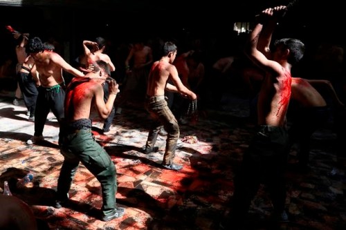 FILE - In this Sunday, Oct. 9, 2016 file photo, Shiite Muslim men beat themselves with knives attached to chains during a procession to mark Ashoura in Kabul, Afghanistan. In a report released on Wednesday, March 13, 2019, researchers say self-flagellation should be added to the list of ways to spread a dangerous viral blood infection. (AP Photo/Rahmat Gul)