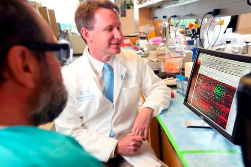 This 2015 photo made available by the Feature Photo Service for IBM shows Dr. Norman Sharpless, director of the University of North Carolina Lineberger Comprehensive Cancer Center, examines DNA sequencing data in Chapel Hill, N.C. On Tuesday, March 12, 2019, The Food and Drug Administration announced that Sharpless will temporarily take charge of the agency next month after the departure of its current chief, Scott Gottlieb. (Jared Lazarus/Feature Photo Service for IBM via AP)