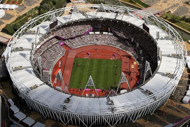 FILE - In this Aug. 3, 2012, file photo, Olympic Stadium is viewed during the Summer Olympics at Olympic Park in London. The traditional rivalry New York Yankees and the Boston Red Sox will take a radical twist when they meet in London next month: They will play on artificial turf for the first time in more than 2,200 games over a century. Major League Baseball has access to Olympic Stadium for 21 days before the games on June 29 and 30, the sport's first regular-season contests in Europe, and just five days after to clear out. (AP Photo/Jeff J Mitchell, Pool, File)