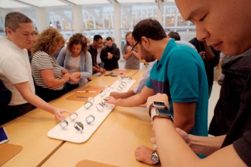 FILE- In this Sept. 21, 2018 file photo customers look at Apple Watches at an Apple store in New York. A huge study suggests the Apple Watch sometimes can detect a worrisome irregular heartbeat. But experts say more work is needed to tell if using wearable technology to screen for heart problems really helps. (AP Photo/Patrick Sison, File)