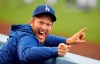 FILE - In this May 25, 2018, file photo, Los Angeles Dodgers pitcher Clayton Kershaw jokes around in the dugout prior to a baseball game against the San Diego Padres in Los Angeles. The photo was part of a series of images by photographer Mark J. Terrill which won the Thomas V. diLustro best portfolio award for 2018 given out by the Associated Press Sports Editors during their annual winter meeting in in Lake Buena Vista, Fla. (AP Photo/Mark J. Terrill, File)