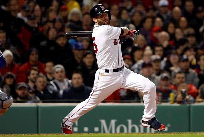 FILE - In this April 11, 2019, file photo, Boston Red Sox's Dustin Pedroia follows through on an RBI-single against the Toronto Blue Jays during the third inning of a baseball game at Fenway Park in Boston. Pedroia will take an