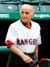 FILE - In this Aug. 16, 2008, file photo, former Texas Rangers manager Frank Lucchesi walks onto the field during the team's Hall of Fame induction ceremony prior to a Major League Baseball game against the Tampa Bay Rays in Arlington, Texas. Lucchesi, who replaced the fired Billy Martin as manager of the Rangers in 1975 has died. He was 92. The Rangers said Lucchesi died Saturday, June 8, 2019. (AP Photo/Tony Gutierrez, File)