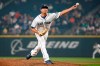 FILE - In this Aug. 21, 2018, Seattle Mariners relief pitcher Zach Duke throws out a pitch against the Houston Astros during the ninth inning of a baseball game in Seattle. A person familiar with the discussions tells The Associated Press that the Cincinnati Reds are working to complete a deal with Duke that would add the left-hander to their bullpen. (AP Photo/Jennifer Buchanan, File)