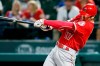 FILE - In this Sept. 5, 2018, file photo, Los Angeles Angels' Shohei Ohtani follows through on a two-run home run against the Texas Rangers during the eighth inning of a baseball game in Arlington, Texas. Ohtani got a modest raise from the Angels after winning the AL Rookie of the Year award, agreeing to a one-year contract that boosts his pay to $650,000 from last year‚Äôs minimum of $545,000. (AP Photo/Ray Carlin, File)