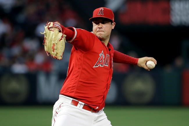 FILE - In this June 29, 2019, file photo, Los Angeles Angels starting pitcher Tyler Skaggs throws to the Oakland Athletics during a baseball game in Anaheim, Calif. Skaggs died from a toxic mix of the powerful painkillers fentanyl and oxycodone along with alcohol in an accidental overdose, a medical examiner in Texas ruled in a report released Friday, Aug. 30, 2019. (AP Photo/Marcio Jose Sanchez, File)