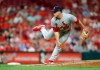 FILE - In this Aug. 15, 2019, file photo, St. Louis Cardinals relief pitcher Ryan Helsley throws against the Cincinnati Reds during the eighth inning of a baseball game in Cincinnati. Helsley was disappointed by his first exposure to the Atlanta Braves’ fans use of the Tomahawk Chop for their chants during games. Helsley’s vantage point is different than most players who visit SunTrust Park. He is a member of the Cherokee nation. (AP Photo/Gary Landers, File)