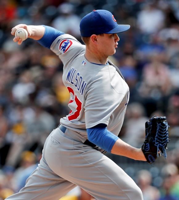 FILE - In this Aug. 19, 2018, file photo, Chicago Cubs relief pitcher Justin Wilson throws against the Pittsburgh Pirates in a baseball gam in Pittsburgh. A person familiar with the negotiations tells The Associated Press that left-hander Wilson and the New York Mets have agreed to a $10 million, two-year contract. The person spoke on condition of anonymity Friday, Jan. 25, 2019, because the agreement was subject to a successful physical. (AP Photo/Keith Srakocic, File)