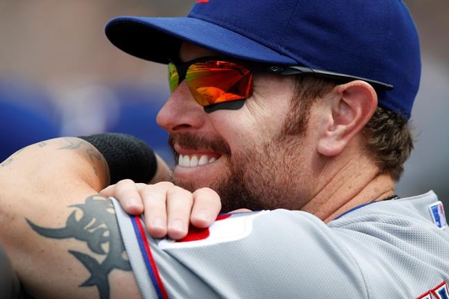 FILE - In this July 22, 2015, file photo, Texas Rangers left fielder Josh Hamilton (32) looks on during a baseball game against the Colorado Rockies in the seventh inning in Denver. Hamilton will be inducted into the Rangers Hall of Fame on Aug. 17, 2019. (AP Photo/David Zalubowski, File)