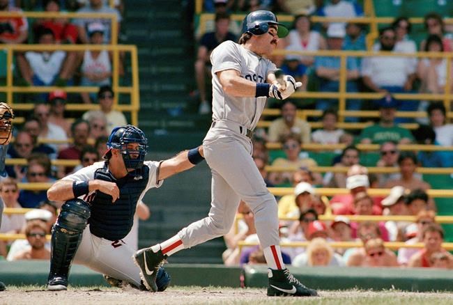 FILE - In this June 1, 1987, file photo Boston Red Sox's Bill Buckner, right, hits a two-run home run in the second inning of a baseball game against against the Chicago White Sox in Chicago. Buckner, a star hitter who became known for making one of the most infamous plays in major league history, has died. He was 69. Buckner's family said in a statement that he died Monday, May 27, 2019, after a long battle with dementia. (AP Photo/Mark Elias, File)