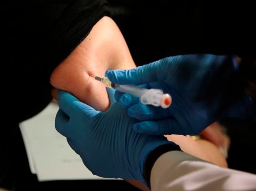 FILE - In this March 27, 2019, file photo, a woman receives a measles, mumps and rubella vaccine at the Rockland County Health Department in Pomona, N.Y. Measles cases in the U.S. this year have climbed to the highest level in 25 years, according to preliminary figures, a resurgence attributed largely to misinformation about vaccines. (AP Photo/Seth Wenig, File)
