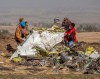 FILE - In this March 11, 2019, file photo, rescuers work at the scene of an Ethiopian Airlines flight crash near Bishoftu, Ethiopia. A published report says pilots of an Ethiopian airliner that crashed followed Boeing‚Äôs emergency steps for dealing with a sudden nose-down turn but couldn‚Äôt regain control. (AP Photo/Mulugeta Ayene, File)