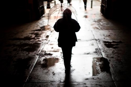 FILE - In this Feb. 12, 2019 file photo, a pedestrian passes beneath City Hall in Philadelphia during a winter storm. Paying off debt requires taking the right actions now to avoid problems down the road. (AP Photo/Matt Rourke, File)