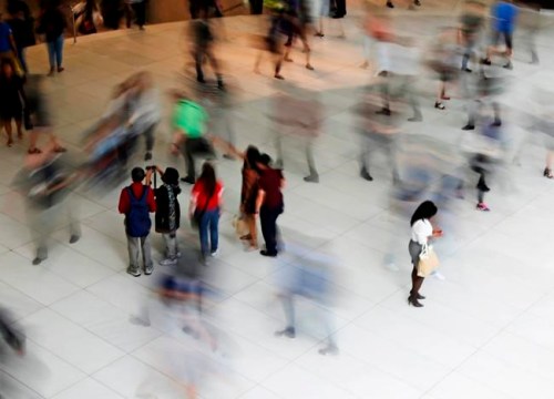 FILE- In this June 15, 2017, file photo, people walk inside the Oculus, the new transit station at the World Trade Center in New York. Getting your credit score today is easy, just turn to your bank, credit card issuer or one of the many apps and websites out there. That means millennials, unlike their parents, have the advantage of early insight into their financial profiles. (AP Photo/Frank Franklin II, File)