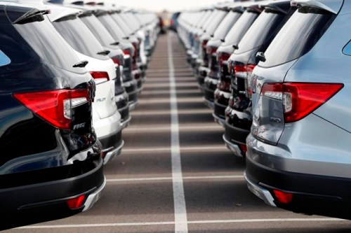 In this Wednesday, Nov. 28, 2018, photograph, a long lines of unsold 2019 Pilot sports-utility vehicles sit at a Honda dealership in Highlands Ranch, Colo. Emotions run high when you‚Äôre buying a new or used car. So it‚Äôs easy to overlook details that could cost you in the long run. (AP Photo/David Zalubowski)