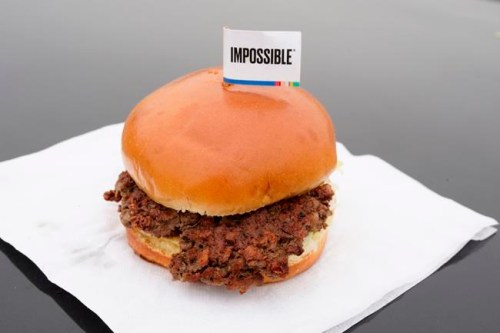 FILE- This Jan. 11, 2019, file photo shows the Impossible Burger, a plant-based burger containing wheat protein, coconut oil and potato protein among it's ingredients in Bellevue, Neb. From soy-based sliders to ground lentil sausages, plant-based meat substitutes are surging in popularity. Growing demand for healthier, more sustainable food is one reason people are seeking plant-based meats. (AP Photo/Nati Harnik, File)