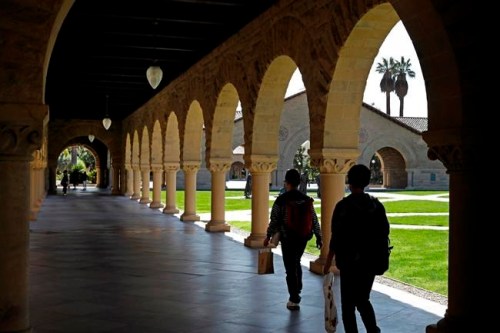 FILE - In this March 14, 2019, file photo, people walk on the Stanford University campus in Santa Clara, Calif. Financial aid award letters are known to be tricky to understand due to jargon and a lack of clarity about how much you have to pay out of pocket. If you can‚Äôt interpret your financial aid award, you won‚Äôt be able to compare letters from different schools. (AP Photo/Ben Margot, File)