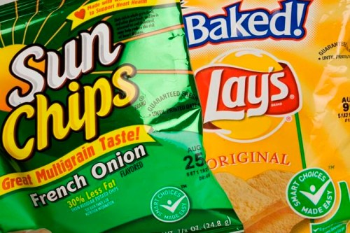 FILE- In this June 15, 2007, file photo bags of potato chips from PepsiCo's Frito-Lay division are shown in New York. PepsiCo is testing a way to bring snacks directly to college students. The chip and beverage maker says it will start making deliveries with self-driving robots on Thursday, Jan. 3, 2019, at the University of the Pacific in Stockton, Calif. Students will be able to order Baked Lay‚Äôs, SunChips or Bubly sparkling water on an app, and then meet the six-wheeled robot at more than 50 locations on campus. (AP Photo/Mark Lennihan, File)