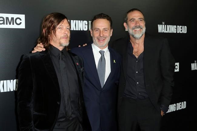 FILE - In this Sept. 27, 2018 file photo, from left to right, Norman Reedus, Andrew Lincoln and Jeffrey Dean Morgan arrive at the LA Premiere of Season 9 of their show