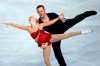 FILE - In this Nov. 15, 2013, file photo, Caydee Denney and John Coughlin, of the United States, perform during their Pairs Short Program during the ISU Figure Skating Eric Bompard Trophy at Bercy arena in Paris. Coughlin, a two-time U.S. pairs champion recently suspended from figure skating, has died. He was 33. U.S. Figure Skating released a statement Saturday, Jan. 19, 2019, and cited his sister, Angela Laune. The sister said in a Facebook post that her 