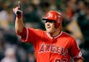 FIEL - In this April 3, 2017, file photo, Los Angeles Angels' Mike Trout celebrates after hitting a two-run home run off Oakland Athletics' Kendall Graveman in the third inning of a baseball game in Oakland, Calif. A person familiar with the negotiations tells The Associated Press Tuesday, March 19, 2019, that Trout and the Angels are close to finalizing a record $432 million, 12-year contract that would shatter the record for the largest deal in North American sports history. (AP Photo/Ben Margot, File)