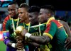 FILE - In this Feb. 5, 2017, file photo, Cameroon players pose with the trophy after winning the African Cup of Nations final soccer match against Egypt at the Stade de l'Amitie, in Libreville, Gabon. Cameroon was stripped of the right to host next year‚Äôs African Cup of Nations soccer tournament on Friday, Nov. 30, 2018, with its preparations way behind schedule and a violent separatist rebellion in parts of the country making it a security risk. (AP Photo/Sunday Alamba, FIle)