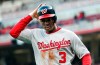 FILE- In this March 30, 2018, file photo, Washington Nationals' Michael A. Taylor runs back to the dugout after scoring in the ninth inning of an opening day baseball game against the Cincinnati Reds in Cincinnati. Taylor favored his left leg as he limped through the clubhouse Friday, March 15, 2019, before heading to have an MRI exam on his sore knee and hip. He said his knee and hip stiffened up after he made a diving catch against Minnesota on Thursday.Â  (AP Photo/John Minchillo, File)