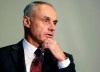 FILE - In this Wednesday, March 6, 2019, file photo, Major League Baseball Commissioner Rob Manfred addresses an audience at a gathering of the Boston College Chief Executives Club in Boston. Good but unexceptional veterans must realize teams find them less valuable in the age of analytics, Manfred maintained ahead of season openers. Players have expressed anger following the second straight slow free-agent market. There have been record deals for top stars and plummeting prices for many journeymen. (AP Photo/Steven Senne, File)